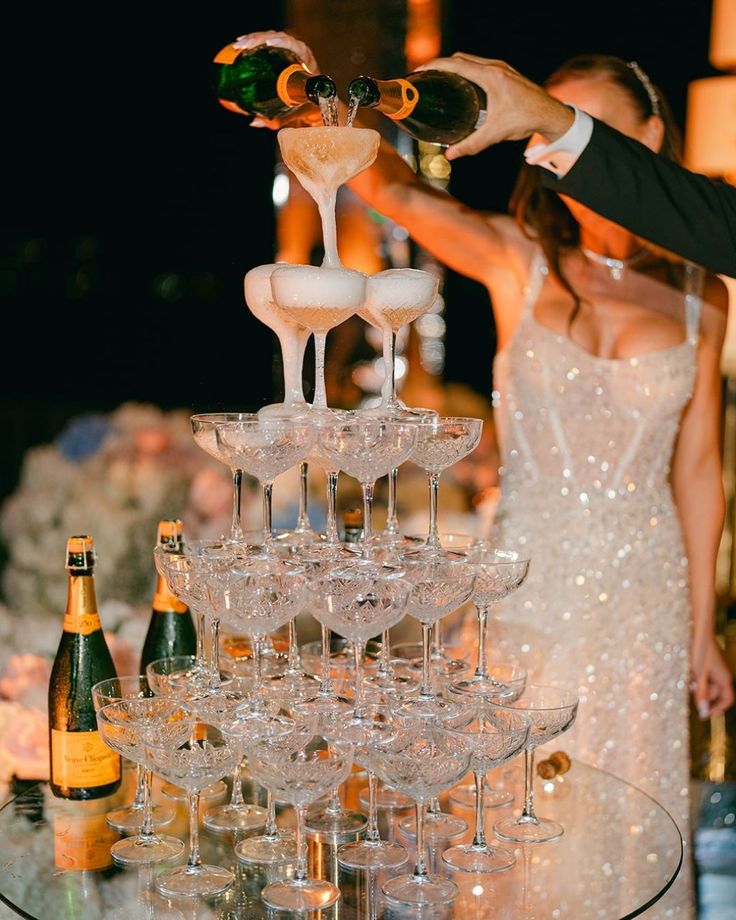 Champagne tower moment at a glamorous wedding by Shake & Strain Bar